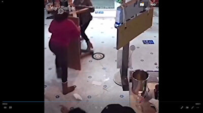 Fearless grandma beats woman with table after customer throws bottle at staff