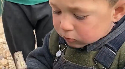 War-torn Turkmen child eagerly eats chocolate in Syria in heartbreaking video