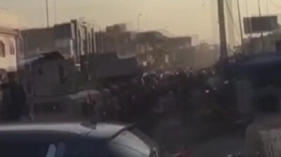 Anti-government protestors take to streets in Iraq; policeman shot in the head