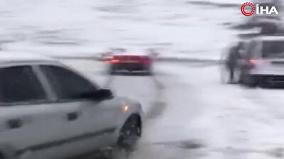 Snow wreaks havoc on traffic as car slams into parked vehicle