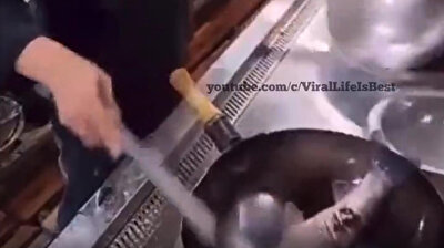 Fresh fish! Chef karate chops live fish in hot pan