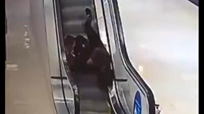 Cursed escalator: Girls tumble and trip over each other in China