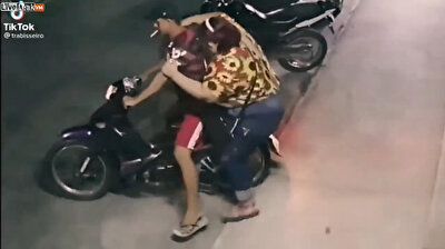 Overweight woman tips motorcyle over