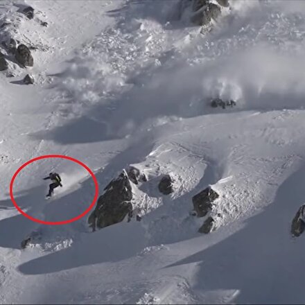 Çığa neden olup kıl payı kurtulan snowboardcu