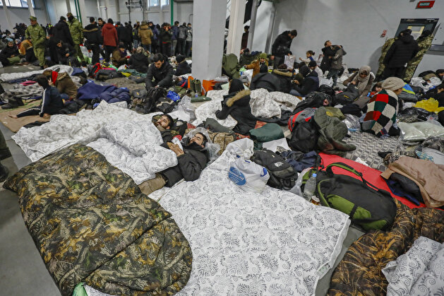 Belarus gov't moves migrants at Polish border to heated warehouse