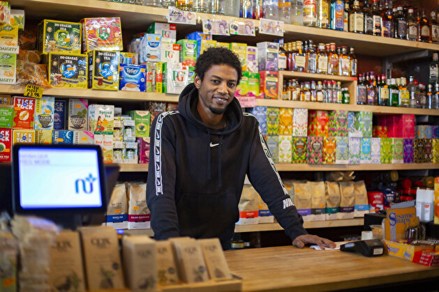 Portraits of migrant shopkeepers living in London