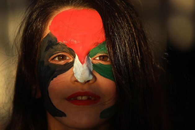 Palestinians converge at destroyed cafe following Israeli attacks on Gaza