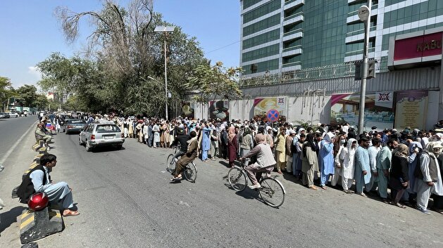 Afghans wait in long queues outside banks in Kabul