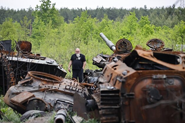 Ukrainians show interest in destroyed military vehicles outside Kyiv