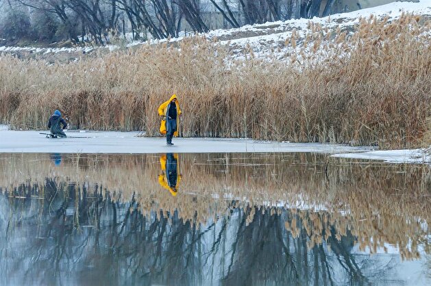 Fishing on frozen lake in Van