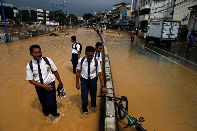 Jakarta embraces flood after heavy rain
