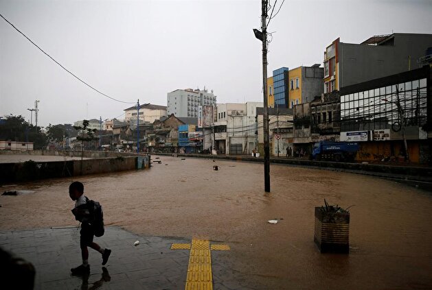Jakarta embraces flood after heavy rain