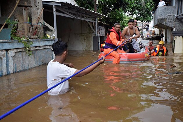 Jakarta embraces flood after heavy rain