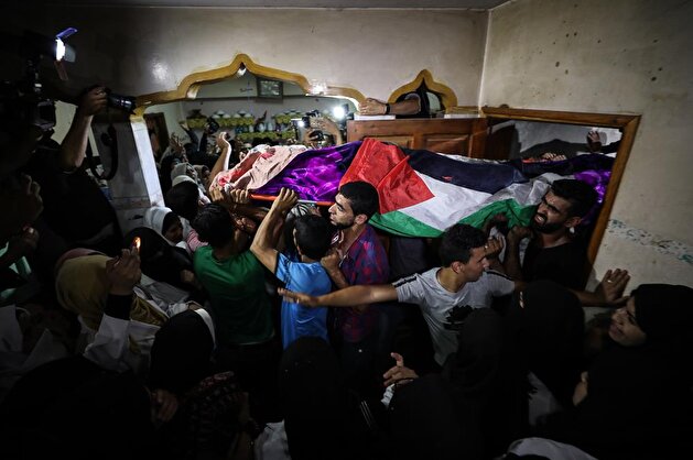 Palestinians attend funeral of fallen paramedic killed by Israeli snipers