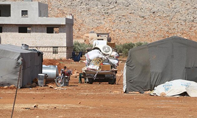 Idlib residents leave their homes