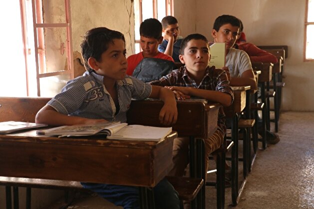 Despite Assad bombings, defiant children, teachers continue education