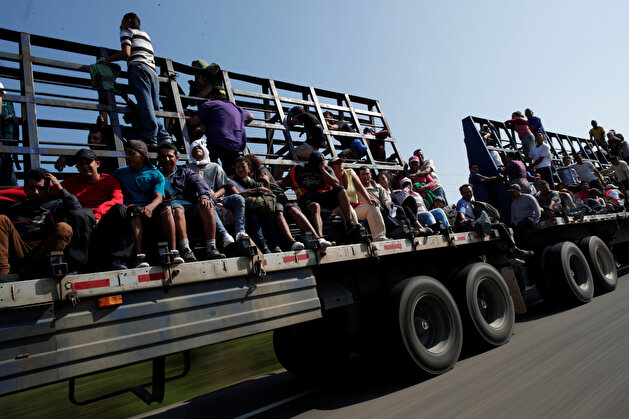 Migrants raveling en route to US hitch a ride near Matias Romero Avendano