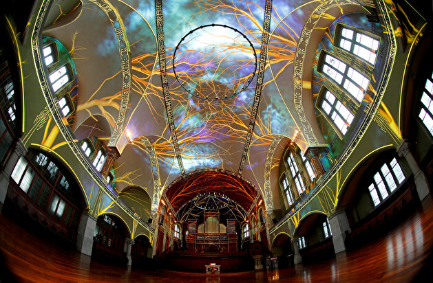A light projection shows the 'Genesis' multimedia project at the St. Jakob-Kirche in Zurich