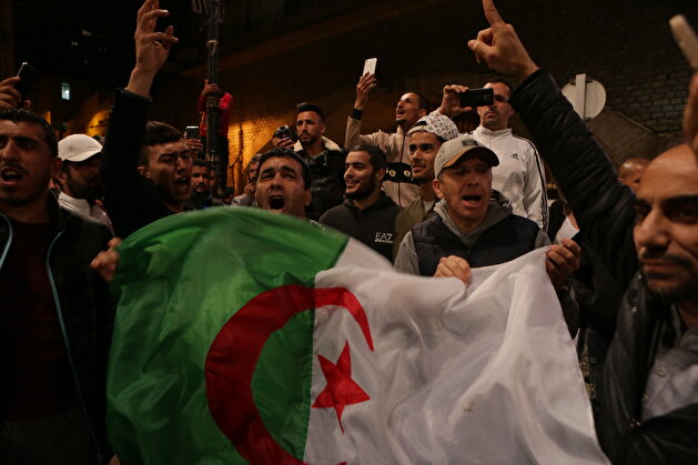 People celebrate after Algeria's President Abdelaziz Bouteflika submitted his resignation