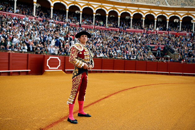 Famous matadors perform talents during a bullfight in Seville