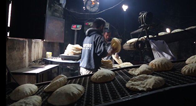 Turkish soldiers distribute bread during Peace Spring Operation in N. Syria