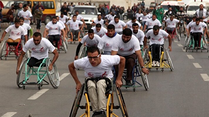 Diasbled Palestinians compete in wheelchair marathon in Gaza
