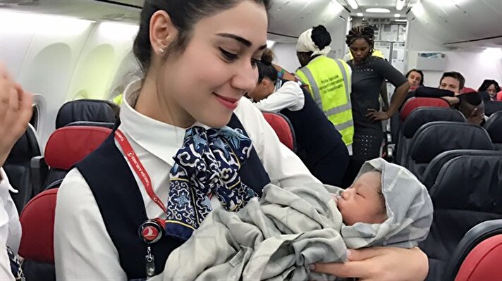 Mother Diaby Nafi holds a baby girl who was born during a flight from Guinea to Istanbul on April 7, 2017. The cabin crew helped the proud mother deliver baby Kadiju and later took pictures. ​​​​