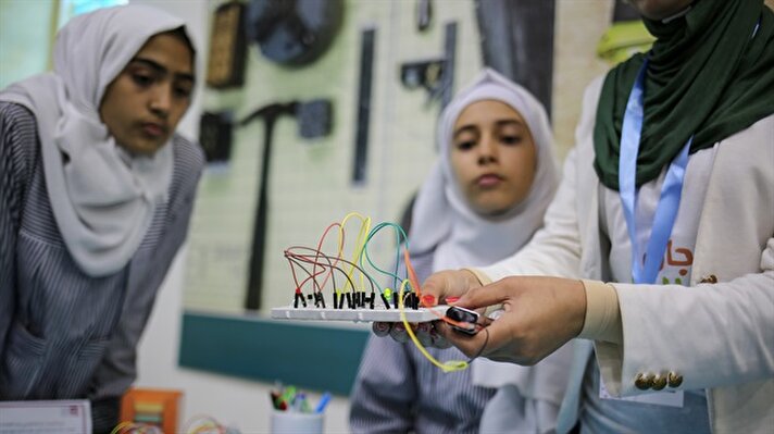  A Palestinian girl displays her science project during the Science Days Palestine Festival 2017 in Gaza City, Gaza on October 17, 2017