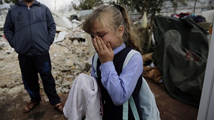 Israeli soldiers have demolished the houses of three Palestinian families in Eastern Jerusalem under the pretext of being “unlicensed.” Eight-year-old Doaa could not fight back tears upon seeing the ruins of what used to be her family home.

