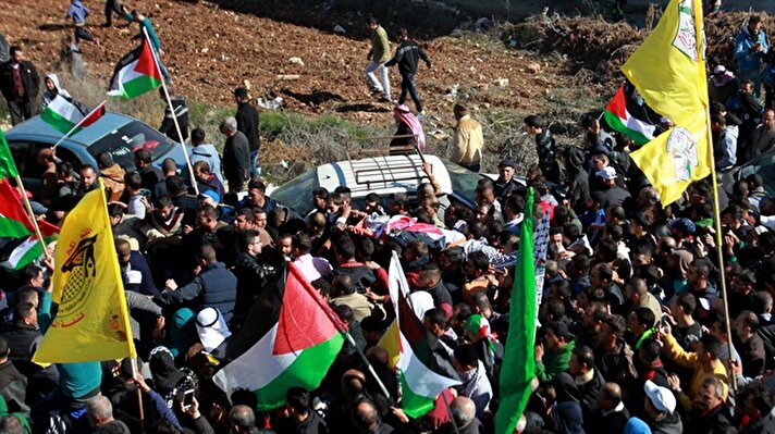  Palestinians attend the funeral ceremony for a 48-year-old Palestinian man, Mahmoud Ouda who was killed by a Jewish settler near the northern West Bank city of Nablus, in Qusra village, Nablus, West Bank on December 2, 2017.