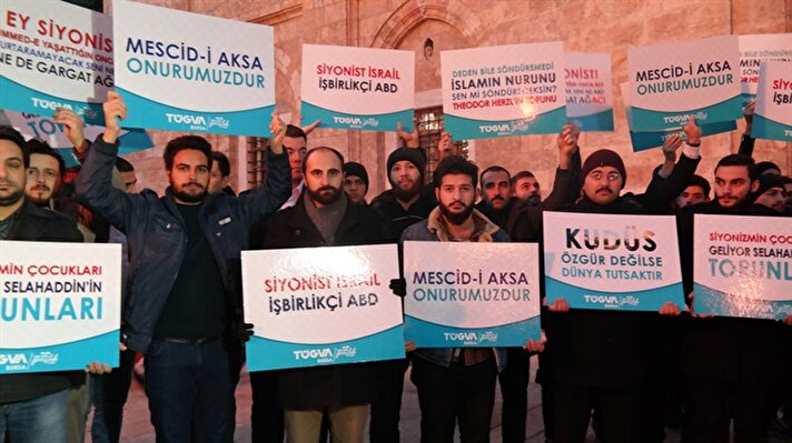 Crowds gathered following Muslims' morning prayer in Turkey's Bursa to denounce Trump's decision to recognize Jerusalem as Israel's capital. Protestors held banners that read “Jerusalem is our honor” and “If Jerusalem is not free, the whole world is in captivity.”

