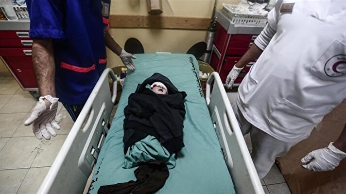 A wounded baby waits for treatment at Indonesia hospital after Israeli army carried out airstikes in Beit Lahia, Gaza on December 8, 2017.