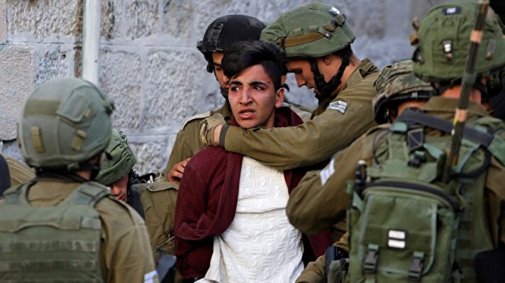 Israeli soldiers detain a Palestinian during clashes at a protest against U.S. President Donald Trump's decision to recognize Jerusalem as the capital of Israel, in the West Bank city of Hebron.
