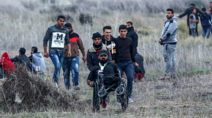Israeli soldiers martyr disabled Palestinian demonstrator