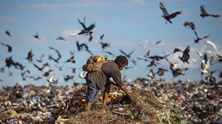 A number of recyclable material collectors, or “catadores de lixo” as they're locally called, working at “Lixao da Estrutural,” Latin America's largest rubbish dump, in Brasilia, Brazil.


