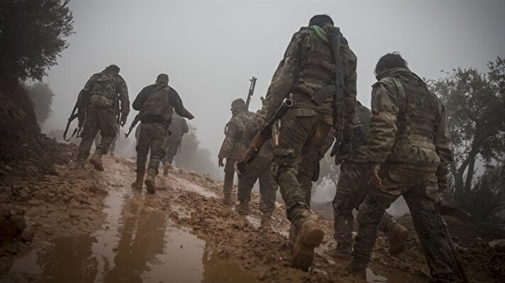 Members of Free Syrian Army (FSA), backed by Turkish Army, are seen as they launch an operation against PYD/PKK in Afrin, as part of the "Operation Olive Branch", on January 23, 2018 in Azez region of Aleppo, Syria. Turkey launched Operation Olive Branch on January 20, 2018 at 5 p.m.(1400GMT) in Syria's northwestern Afrin region; the aim of the operation is to establish security and stability along Turkish borders and the region as well as to eliminate PKK/KCK/PYD-YPG and Daesh terror groups, and protect the Syrian people from the oppression and cruelty of terrorists.​