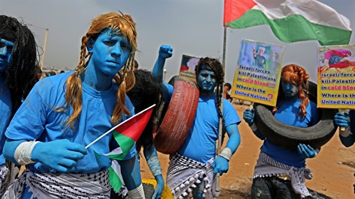 Palestinians dressed as Avatar characters protest near Gaza-Israel border