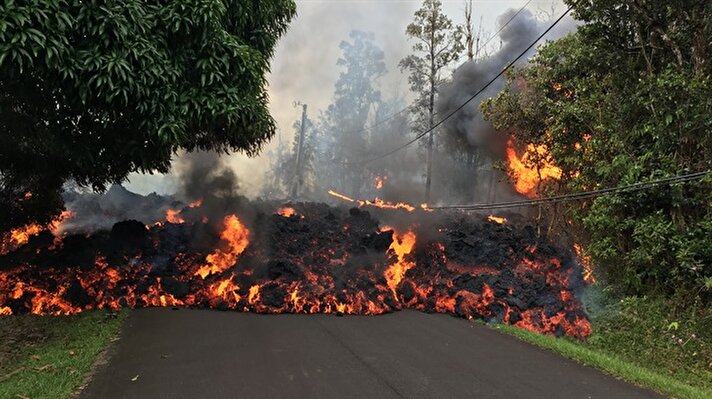 Smoke rises from Kilauea volcano as dozens of structures, including at least nine homes, have been destroyed by scorching lava flows following a massive volcano eruption on Hawaii's Big Island, U.S.
