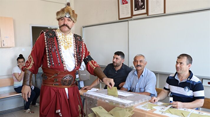 Turks cast votes in wedding dresses, traditional outfits in landmark elections