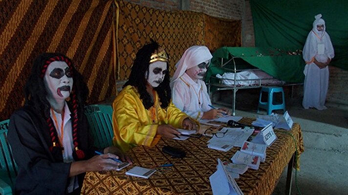 World cup-themed polling stations and election officials dressed as ghosts are just some of the colorful eccentricities of Indonesia's local elections as the country heads to the polls in style.

