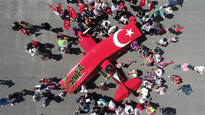Semin Öztürk, Turkey's first professional female aerobatic pilot performs a demonstration flight with her 'Pitts S2-B' plane that has Lycoming engine with 360 horsepower, in Eskisehir, Turkey on July 01, 2018. A 27-year-old aerobatic pilot Semin experienced her first aerobatic flight performing when she was 12 years old with her father Ali Ismet Ozturk who is also an aerobatic pilot. On 19 September 2015, she realized her first airshow at Sivrihisar General Aviation Center. Ozturk will attend the Aeromania Airshow which will take place between July 14-15. The Aeromania Airshow to host 35 aerobatic pilots from many countries.  