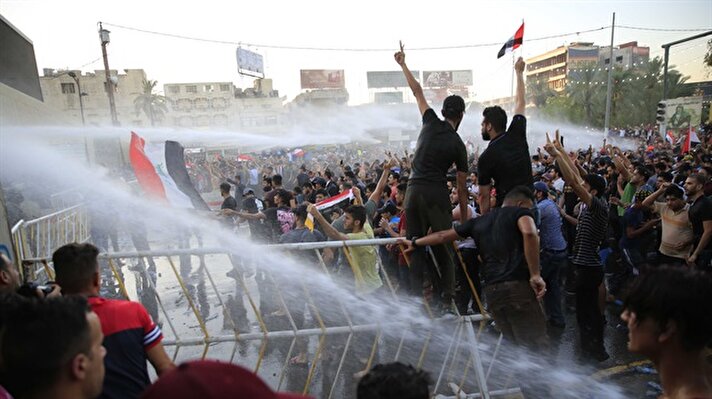 Iraqi people stage a protest against unemployment and power cuts demanding the government's resignation near the Green Zone in Baghdad, Iraq on July 20, 2018.

