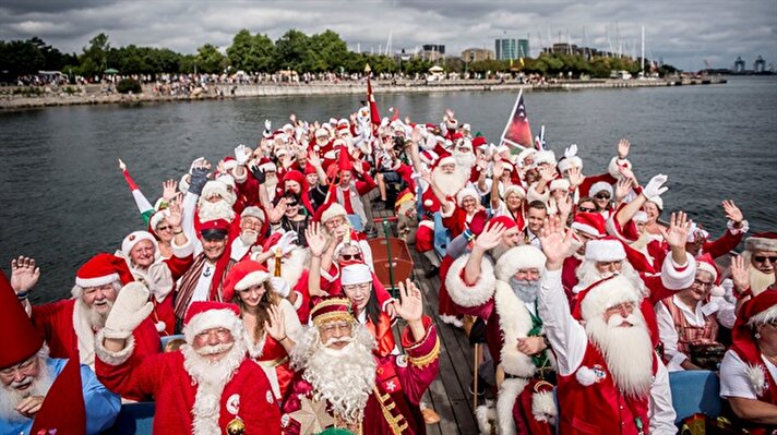 People dressed as Santa Claus take part in the World Santa Claus Congress