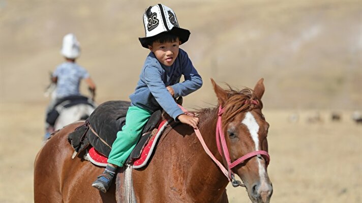 Mounted Kyrgyz children on horseback wait for a training session in Van, Turkey on August 31, 2018. In 1982, Kyrgyz people settled in Ulupamir neighbourhood in Ercis district of Turkey's eastern Van Province after they came from the Great Pamir and Little Pamir in the Wakhan, northern Afghanistan. Team Gokboru of Kyrgyz people in Ulupamir prepare for World Nomad Games, which expected to take place in Turkey in 2020.

