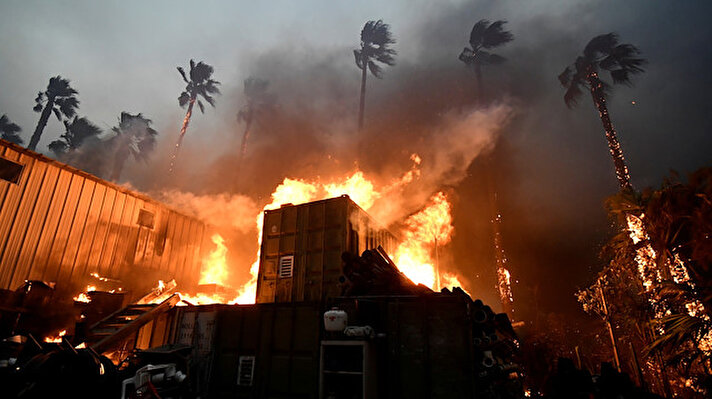 Wildfires burned out of control on Friday across California, killing at least nine people in a mountain town and forcing residents to flee the upscale beach community of Malibu in the face of a monster fire storm.