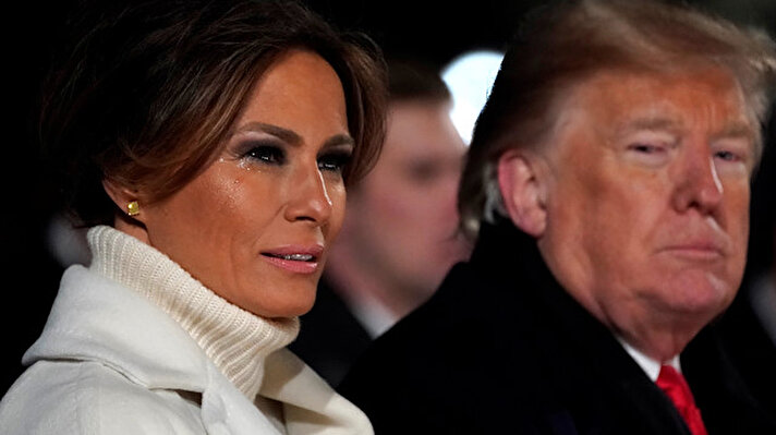 Tears form on U.S. first lady Melania Trump's cheeks in the cold weather as she and President Donald Trump participate in the 96th annual National Christmas Tree Lighting ceremony near the White House in Washington, U.S.

