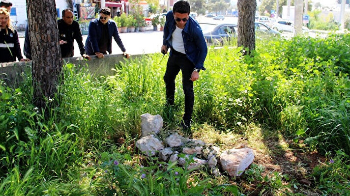 Bodrum'da boş bir arazide bulunan mezar, polis ekiplerini alarma geçirdi.  