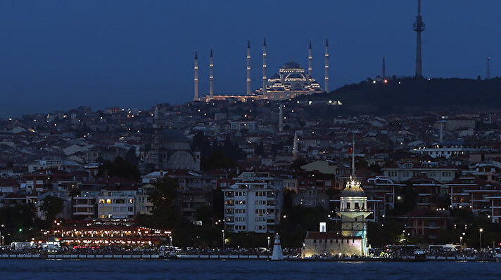 Maiden's Tower and Camlica Mosque are seen at the evening hours of Istanbul, Turkey o