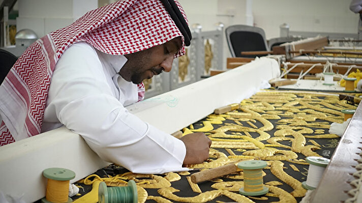 A man sews the Kiswah, the cloth that covers the Kaaba which will be changed on the eve of Eid Al-Adha in Mecca, Saudi Arabia onAugust 08, 2019. 700 kg of raw silk, and 120 kg of gold and silver thread were used by 200 workers to make the Kiswah.
