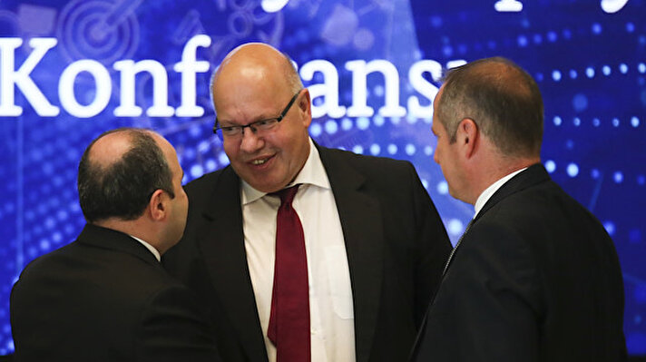 Turkey's Industry and Technology Minister Mustafa Varank (L) and German Federal Minister for Economic Affairs and Energy Peter Altmaier (C) attend the Germany - Turkey Artificial Intelligence Conference in Berlin, Germany on August 22, 2019.
